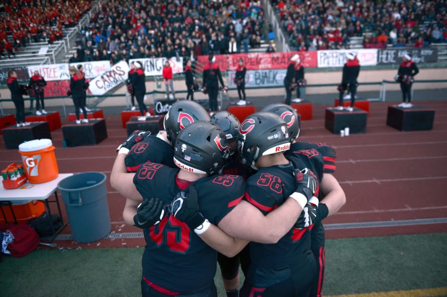 The Camas offensive line huddles before a game against Mount Si at McKenzie Stadium on Saturday afternoon, November 30, 2019. Camas beat Mount Si 35-14 to move on to the 4A state title game.