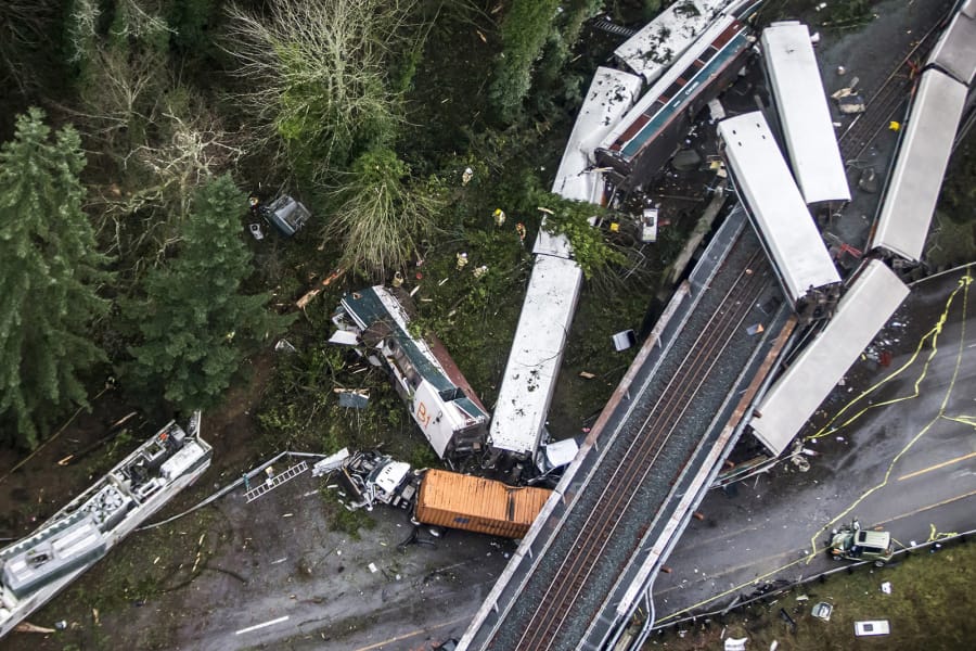 Emergency crews respond after an Amtrak train derailed Dec. 18, 2017, and fell off a bridge and onto Interstate 5 near Mounts Road between Lakewood and Olympia.
