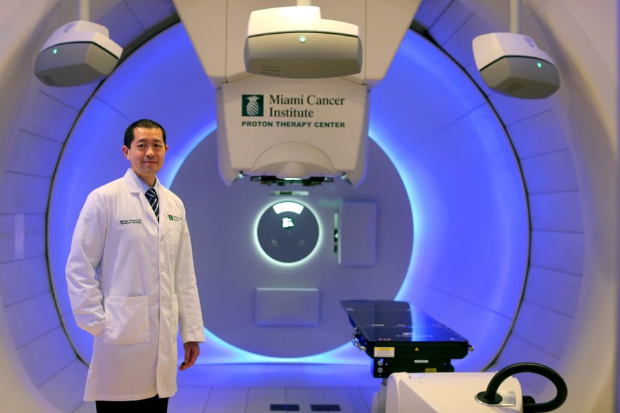 The Miami Cancer Institute in Miami, Fla., has treated 500 patients for many types of cancers with advanced proton therapy technology. Dr. Michael Chuong poses Dec. 6 for a portrait in the gantry with the proton machine.