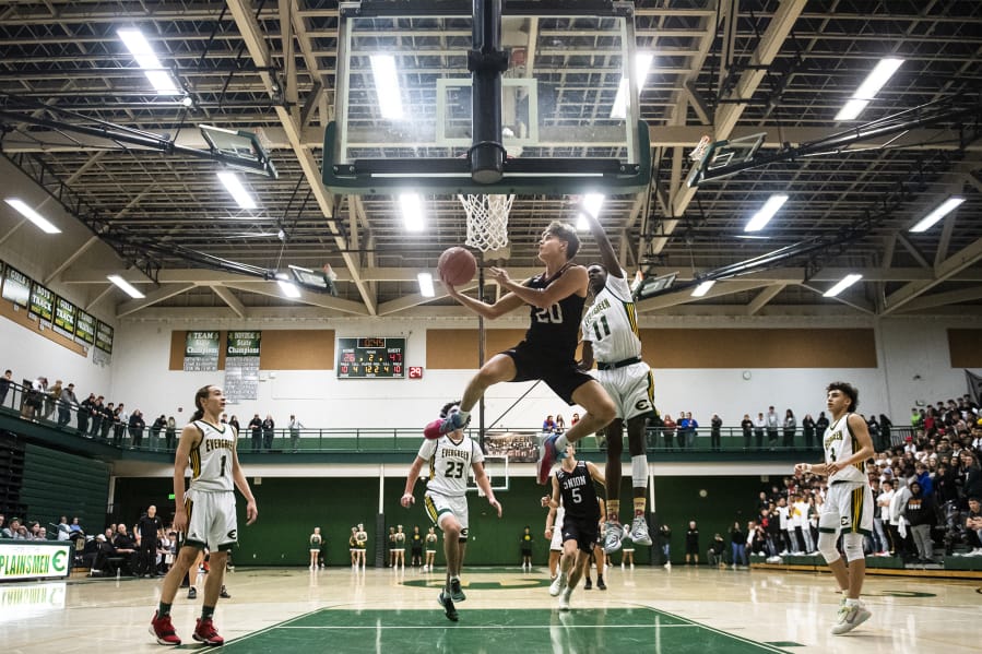 Union&#039;s Josh Reznick competes a layup against Evergreen during a game at Evergreen High School on Wednesday night.