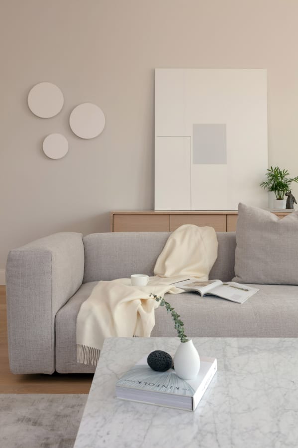 Kashi Shikunova chose a warm white paint color for this room in Bina Gardens in London. To create visual interest, she suggests layering shades of neutrals that complement and contrast.