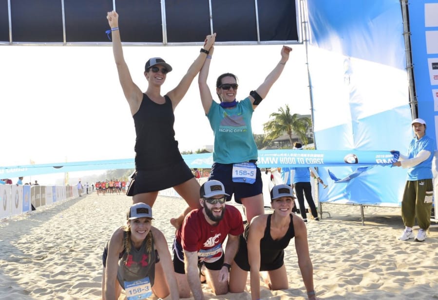 The team of Clark County runners, clockwise from top left, Ericka Carlsen, Marlene Ashworth, Alexis Bond, David Belokonny and Katy Belokonny pose at the finish line after completing Hood to Coast Hainan in China.