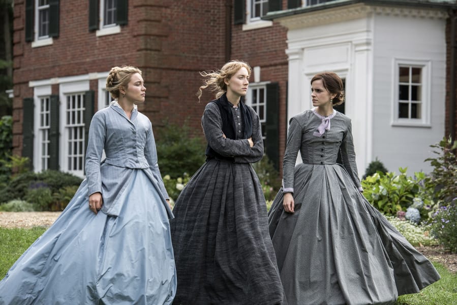 Florence Pugh, from left, Saoirse Ronan and Emma Watson play sisters Amy, Jo and Meg March in &quot;Little Women.&quot; (Wilson Webb/Columbia Pictures)