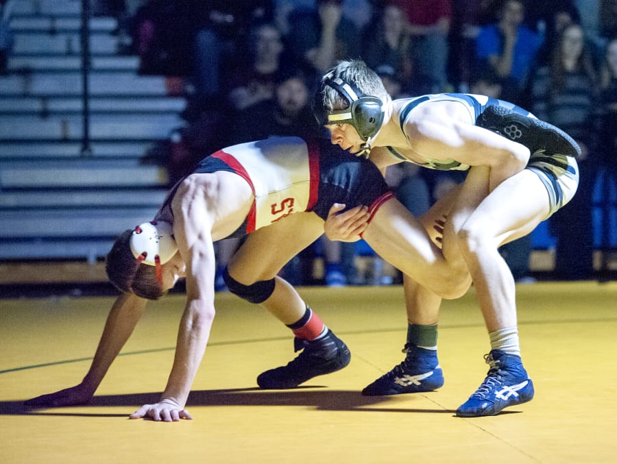 Unionis Spencer Needham pulls the leg of Camasi Porter Craig late in their 106-pound championship match at the Pacific Coast Championships on Saturday at Mountain View High School.