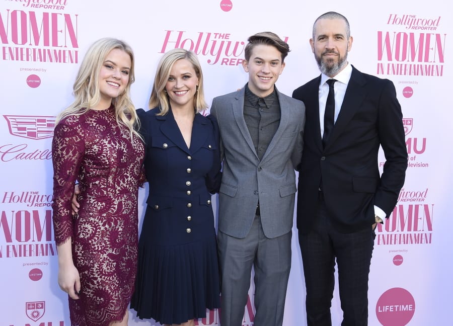 Ava Phillippe, from left, Reese Witherspoon, Deacon Phillippe and Jim Toth arrive at The Hollywood Reporter&#039;s Women in Entertainment Breakfast Gala on Wednesday in Los Angeles.
