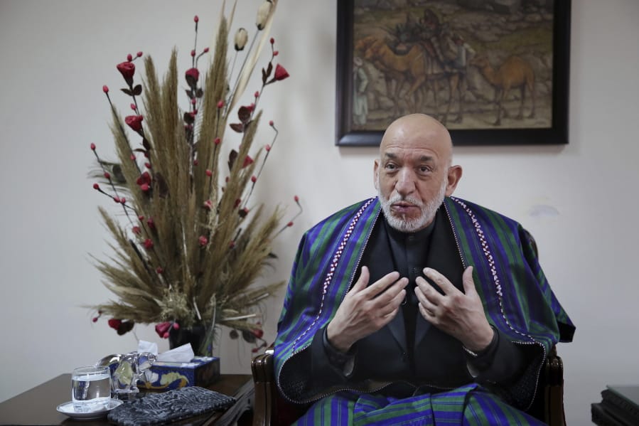 Former Afghan President Hamid Karzai gestures while speaking during an interview with The Associated Press, in Kabul, Afghanistan, Tuesday, Dec. 10, 2019. Karzai, whose final years in power were characterized by a cantankerous relationship with the United States, said on Tuesday that Washington used blackmail and corruption to manipulate his officials, undermine his government and foment violence among the country&#039;s many factions.