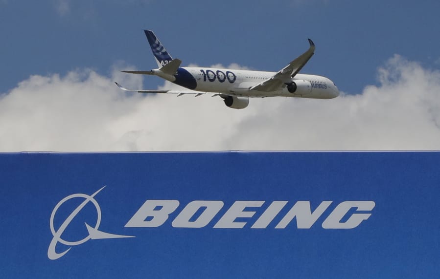 FILE - In this June 17, 2019, file photo, an Airbus A 350 - 1000 performs his demonstration flight at Paris Air Show in Le Bourget, east of Paris, France. Boeing&#039;s grounded 737 Max got a boost from two orders in November, but the American aircraft company continues to trail Europe&#039;s Airbus in both orders and deliveries of airline planes. Boeing disclosed Tuesday, Dec. 10, that it received 11 net orders in November, 63 new orders but 52 cancellations.