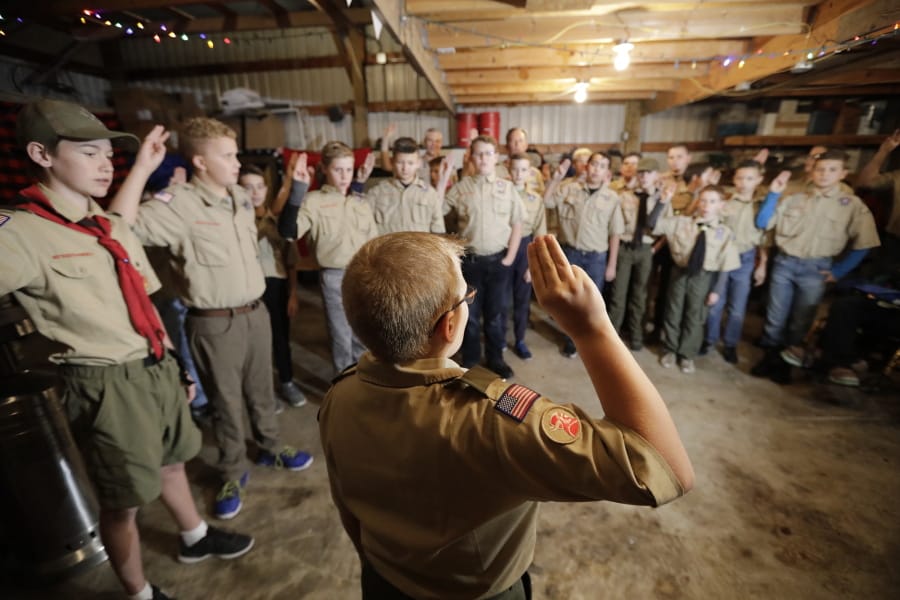 In this Thursday, Dec. 12, 2019 photo, a Boy Scouts troop gathers during their meeting, in Kaysville, Utah. For decades, The Church of Jesus Christ of Latter-day Saints was one of Boy Scouts of America&#039;s greatest allies and the largest sponsor of troops. But on Jan. 1, the Utah-based faith will deliver the latest body blow to the struggling BSA when it implements its plan to pull out more than 400,000 youths and move them into a new global program of its own.
