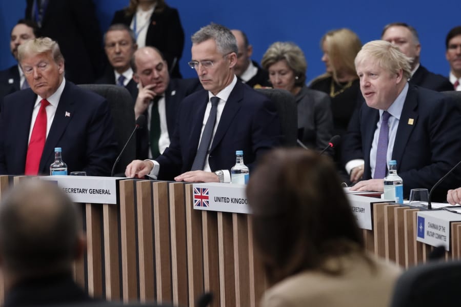 U.S. President Donald Trump, left, and NATO Secretary General Jens Stoltenberg, center, listen to British Prime Minister Boris Johnson, right, during a NATO round table meeting at The Grove hotel and resort in Watford, Hertfordshire, England, Wednesday, Dec. 4, 2019. As NATO leaders meet and show that the world&#039;s biggest security alliance is adapting to modern threats, NATO Secretary-General Jens Stoltenberg is refusing to concede that the future of the 29-member alliance is under a cloud.