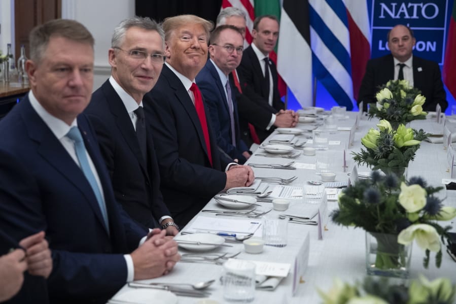 President Donald Trump smiles during a working lunch with NATO members that have met their financial commitments to the the organization, at The Grove, Wednesday, Dec. 4, 2019, in Watford, England.