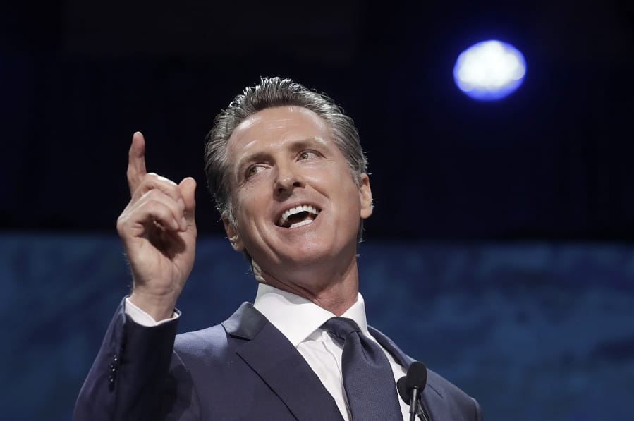 FILE - In this June 1, 2019, file photo, Gov. Gavin Newsom speaks during the 2019 California Democratic Party State Organizing Convention in San Francisco. Gov. Newsom is wrapping up a first year highlighted by the bankruptcy of the country&#039;s largest utility, an escalating homelessness crisis and an intensifying feud with the Trump administration, along with record-low unemployment and a booming state economy producing a multi-billion-dollar surplus.