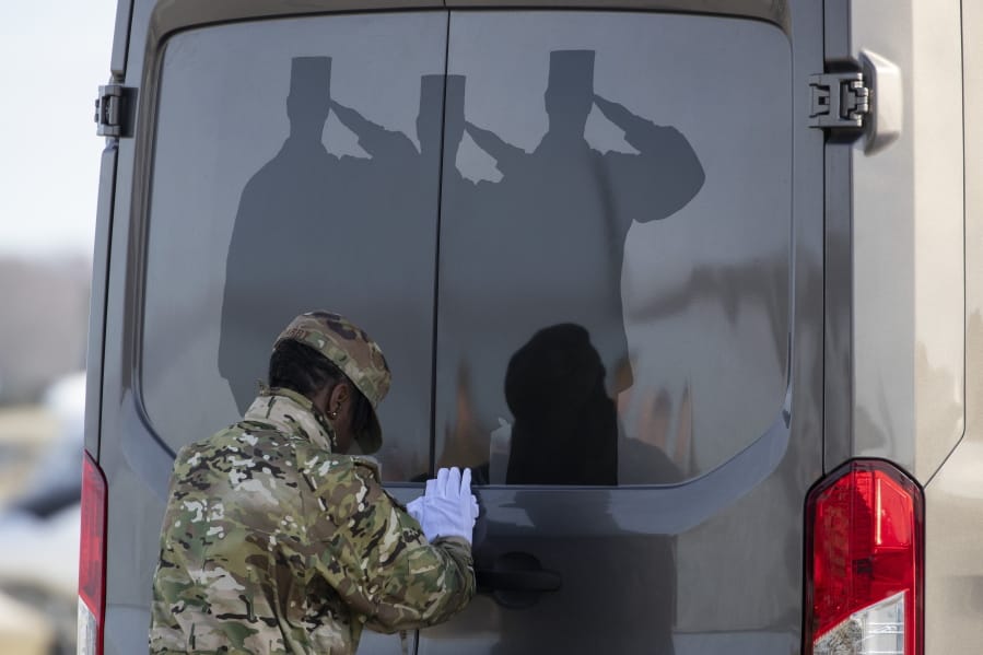 U.S. Air Force Tech. Sgt. Shaquita Darby closes the door of a vehicle containing a transfer case of the remains of U.S. Army Sgt. 1st Class Michael Goble, Wednesday, Dec. 25, 2019, at Dover Air Force Base, Del. According to the Department of Defense, Goble, of Washington Township, N.J., assigned to the 7th Special Forces Group, died while supporting Operation Freedom&#039;s Sentinel.