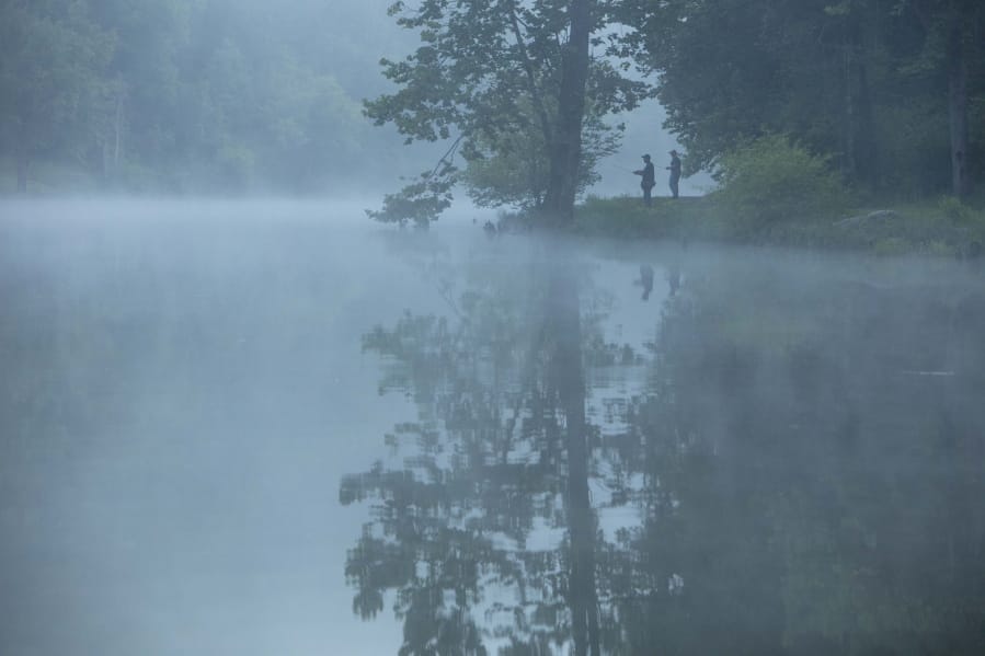 This July 26, 2019 photo provided by The Nature Conservancy shows two people fishing in the mist and fog over the Clinch River as seen from the Clinch Riverwalk on Sugar Hill property in St. Paul, Va. The Cumberland Forest Project protects 253,000 acres of Appalachian forest in Tennessee, Kentucky, and Virginia and is one of TNC&#039;s largest-ever conservation efforts in the eastern United States.