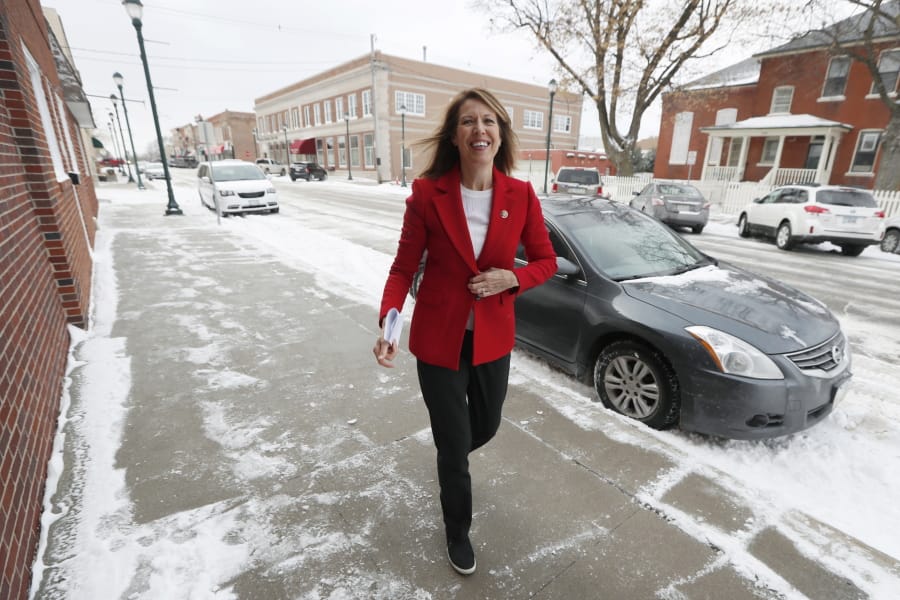In this Nov. 11, 2019, photo, U.S. Rep. Cindy Axne, D-Iowa, arrives at the American Legion Post 184 to speak to local residents in Winterset, Iowa. Axne defeated a Republican incumbent in 2018 even as she lost 15 of her district&#039;s 16 counties. Axne won by offsetting her losses in rural counties with an overwhelming victory in urban Polk County.