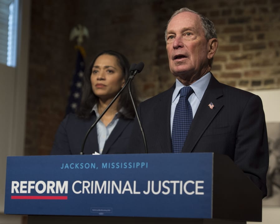 Democratic presidential candidate and former New York City Mayor Michael Bloomberg participates in a roundtable on criminal justice reform led by Jackson, Miss., Mayor Chokwe Antar Lumumba at Smith Robertson Museum, Tuesday, Dec. 2, 2019, in Jackson, Miss. Jennifer Jones Austin, CEO and Executive Director of the Federation of Protestant Welfare Agencies and NYC Department of Correction Board Member, listens at left.