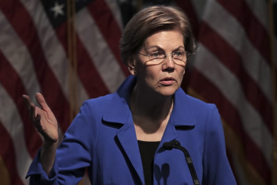 Democratic presidential candidate Sen. Elizabeth Warren, D-Mass., gestures during her address at the New Hampshire Institute of Politics in Manchester, N.H., Thursday, Dec.