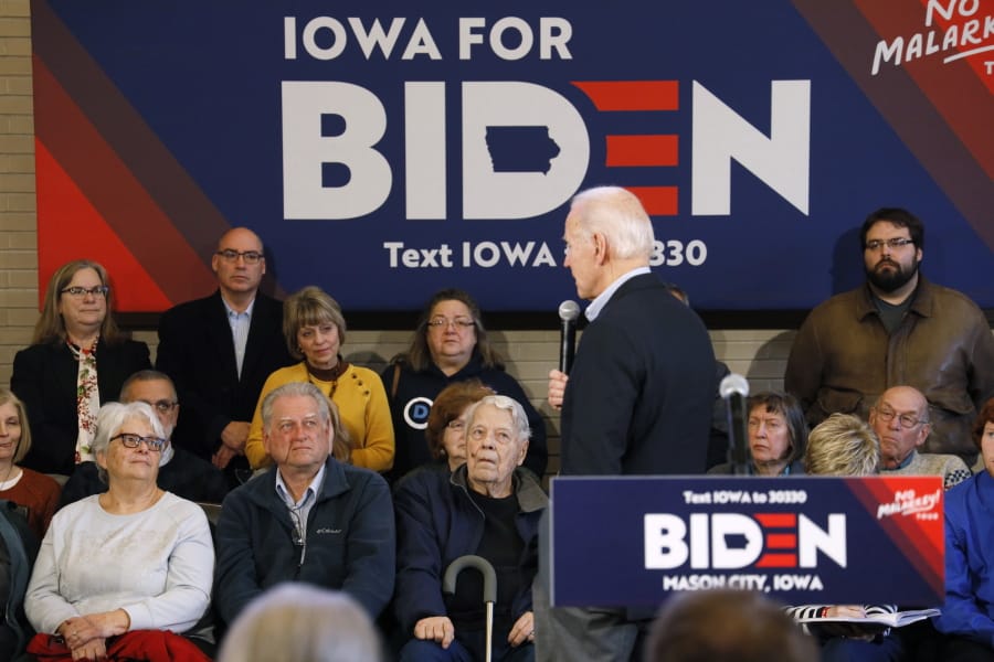 Audience members listen to Democratic presidential candidate former Vice President Joe Biden speak during a bus tour stop, Tuesday, Dec. 3, 2019, in Mason City, Iowa.