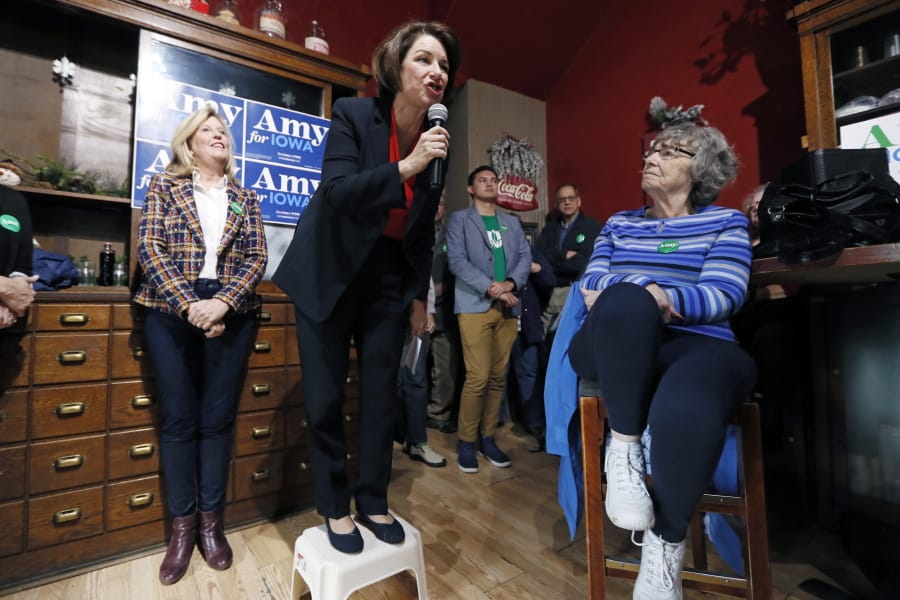 FILE - In this Dec. 6, 2019, file photo, Democratic presidential candidate Sen. Amy Klobuchar, D-Minn., speaks during a stop at the Corner Sundry in Indianola, Iowa. Democrat Amy Klobuchar says she will become the first major 2020 candidate to have visited all 99 Iowa counties after stops scheduled for Friday in the lead off caucus state.