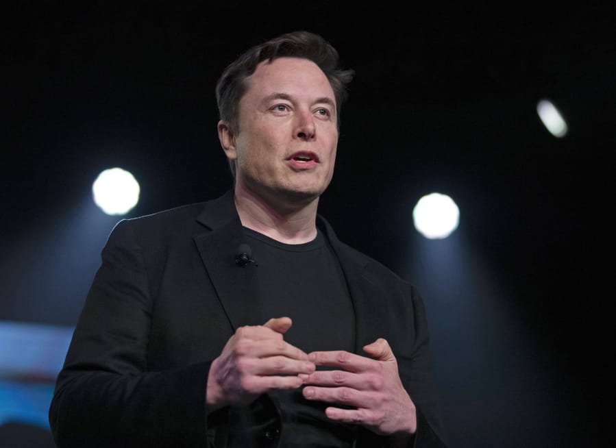 FILE - In this March 14, 2019, file photo, Tesla CEO Elon Musk speaks before unveiling the Model Y at Tesla&#039;s design studio in Hawthorne, Calif. Musk is going on trial for his troublesome tweets in a case pitting the billionaire against a British diver he allegedly dubbed a pedophile. (AP Photo/Jae C.