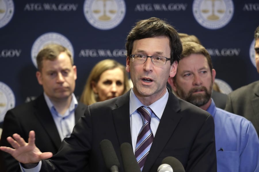 Washington state Attorney General Bob Ferguson speaks at a news conference announcing legislation to combat mass shootings in the state, Thursday, Dec. 12, 2019, in Seattle. Gov. Jay Inslee is joining Ferguson to propose limits to magazine capacity and a ban on the sale of assault weapons.