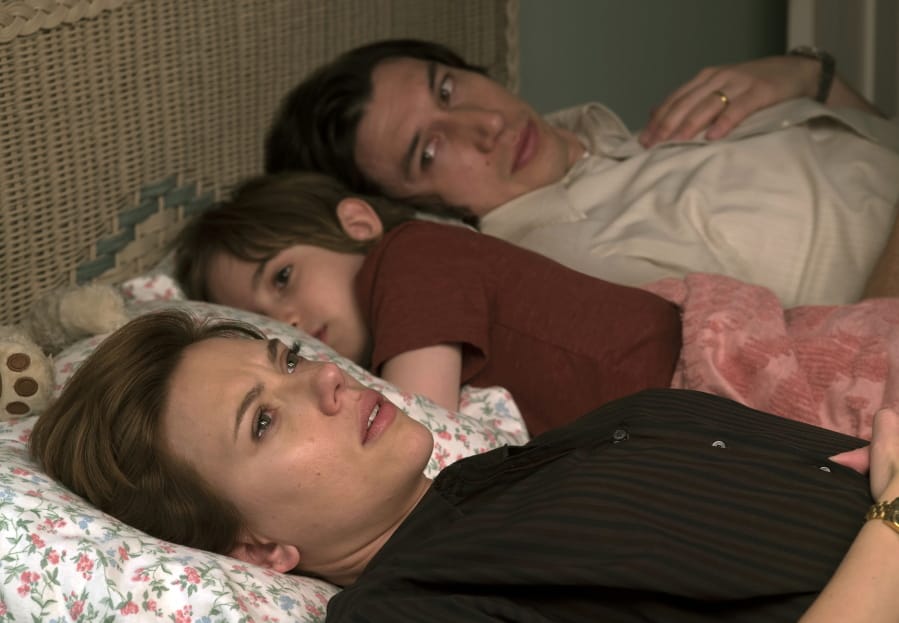 This image released by Netflix shows Scarlett Johansson, left, and Adam Driver in &quot;Marriage Story.&quot; (Netflix via AP)