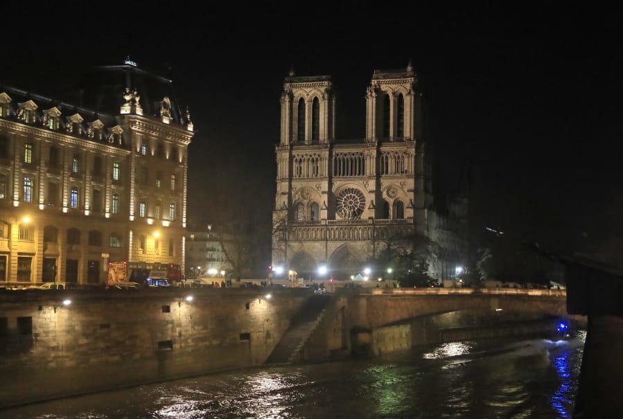 Notre Dame Cathedral is lit up Dec. 16 in Paris. The Notre Dame Cathedral last month was newly illuminated after the April fire.