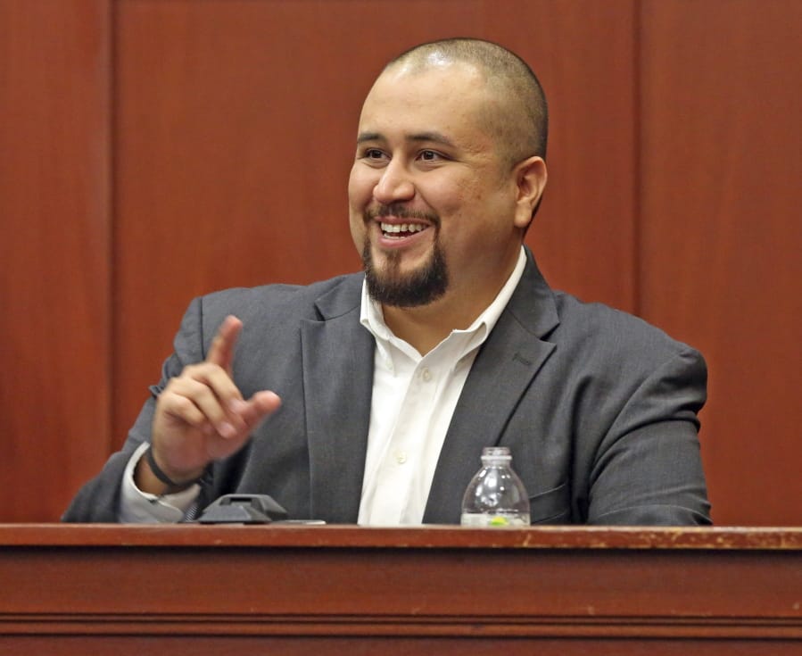 FILE- In this Sept. 13, 2016 file photo, George Zimmerman smiles as he testifies in a Seminole County courtroom in Orlando, Fla. Zimmerman, who was acquitted of the 2012 killing of an unarmed black teen Trayvon Martin, has filed a lawsuit, Wednesday, Dec. 4, 2019, against the teens&#039; parents, family attorney and prosecutors who tried his case, claiming they coached a witness to give false testimony.