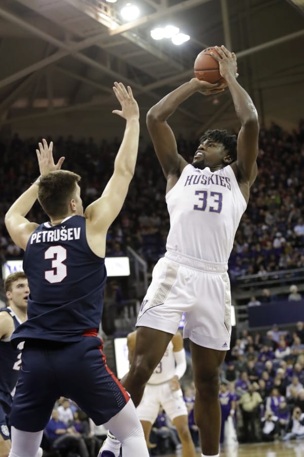 Washington&#039;s Isaiah Stewart (33) shoots over Gonzaga&#039;s Filip Petrusev (3) in the first half of an NCAA college basketball game Sunday, Dec. 8, 2019, in Seattle.