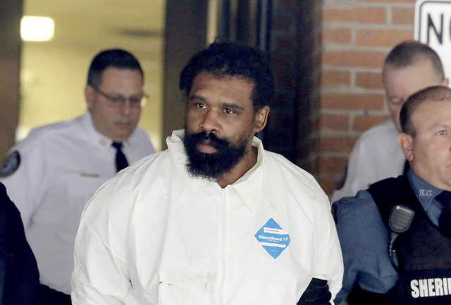 Grafton Thomas is led from Ramapo Town Hall in Ramapo, N.Y. following his arraignment Sunday, Dec. 29, 2019. Thomas was charged in the stabbings of multiple people as they gathered to celebrate Hanukkah at a rabbi’s home in Monsey, an Orthodox Jewish community north of New York City.