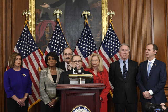From left House Speaker Nancy Pelosi, Chairwoman of the House Financial Services Committee Maxine Waters, D-Calif., Chairman of the House Foreign Affairs Committee Eliot Engel, D-N.Y., House Judiciary Committee Chairman Jerrold Nadler, D-N.Y., Chairwoman of the House Committee on Oversight and Reform Carolyn Maloney, D-N.Y., House Ways and Means Chairman Richard Neal and Chairman of the House Permanent Select Committee on Intelligence Adam Schiff, D-Calif., unveil articles of impeachment against President Donald Trump, during a news conference on Capitol Hill in Washington, Tuesday, Dec.