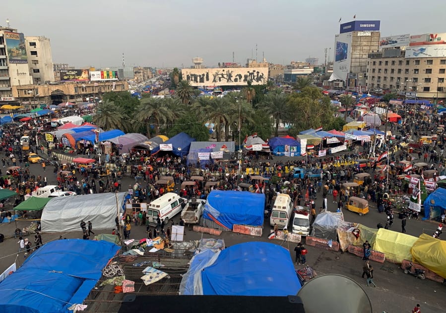 Anti-government protesters gather in Tahrir Square during ongoing protests in Baghdad, Iraq, Tuesday, Dec. 10, 2019.