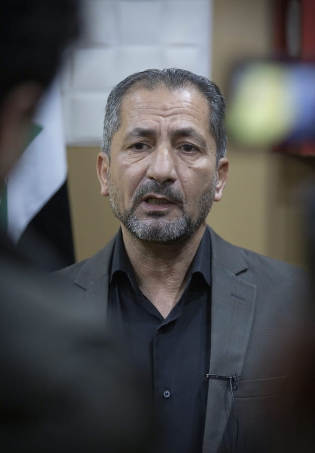 Mohammed Mohieh, the spokesman of Iraq&#039;s Iranian-backed Kataeb Hezbollah, or Hezbollah Brigades, gives an interview at his office, in Baghdad, Iraq, Monday, Dec. 30, 2019. Mohieh said Monday that the death toll from U.S.