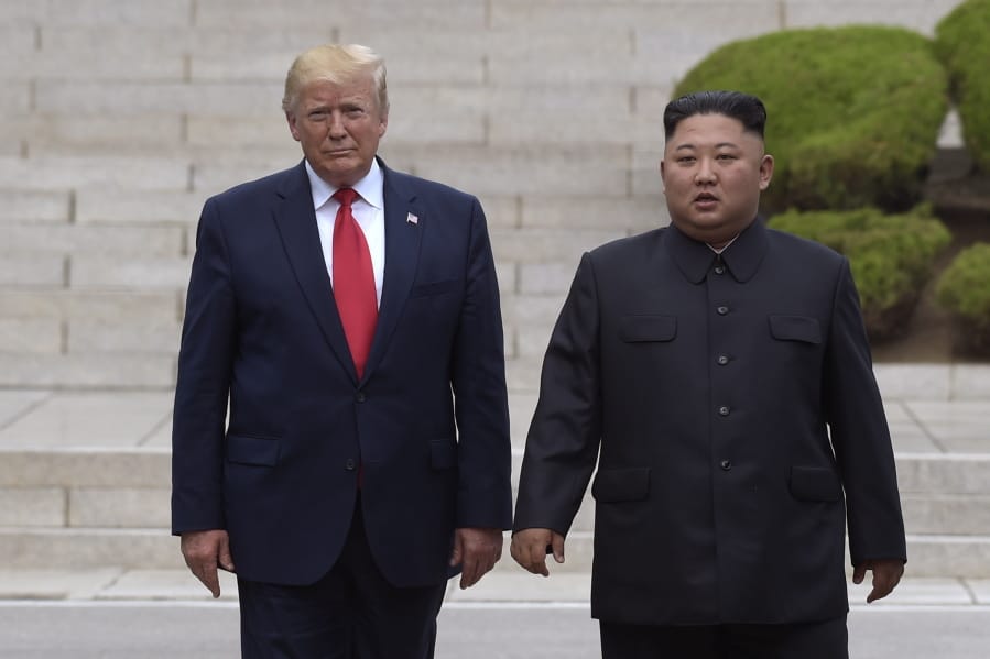 FILE - In this June 30, 2019, file photo, President Donald Trump, left, meets with North Korean leader Kim Jong Un at the North Korean side of the border at the village of Panmunjom in Demilitarized Zone. North Korea threatened Thursday, Dec. 5, to resume insults of Trump and consider him a &quot;dotard&quot; if he keeps using provocative language.