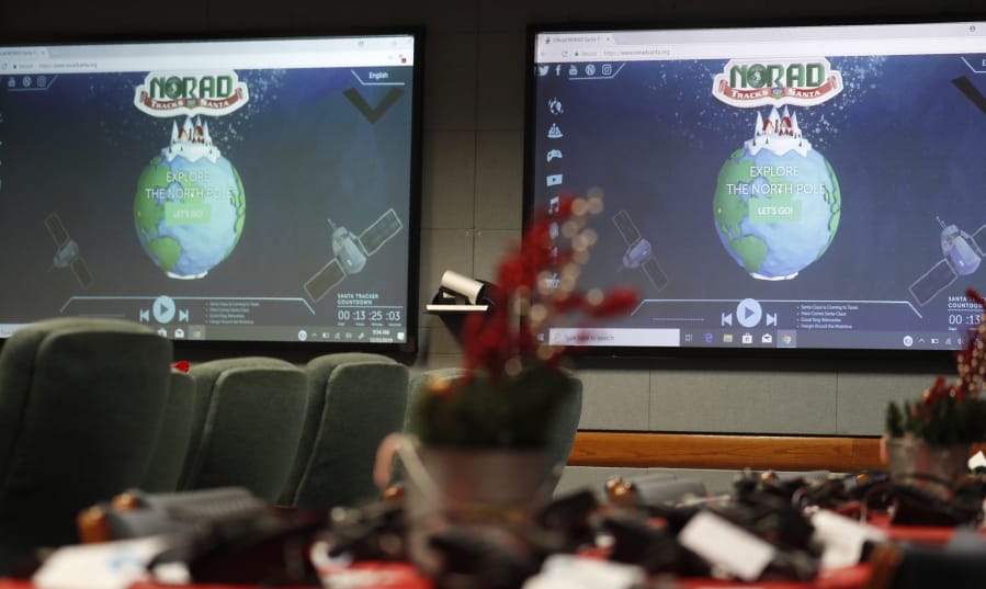 Monitors are illuminated Monday in the NORAD Tracks Santa center at Peterson Air Force Base in Colorado Springs, Colo.