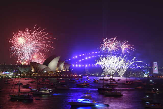 Fireworks are seen from Mrs. Macquarie's Chair during New Year's Eve celebrations in Sydney, Tuesday, Dec. 31, 2019.