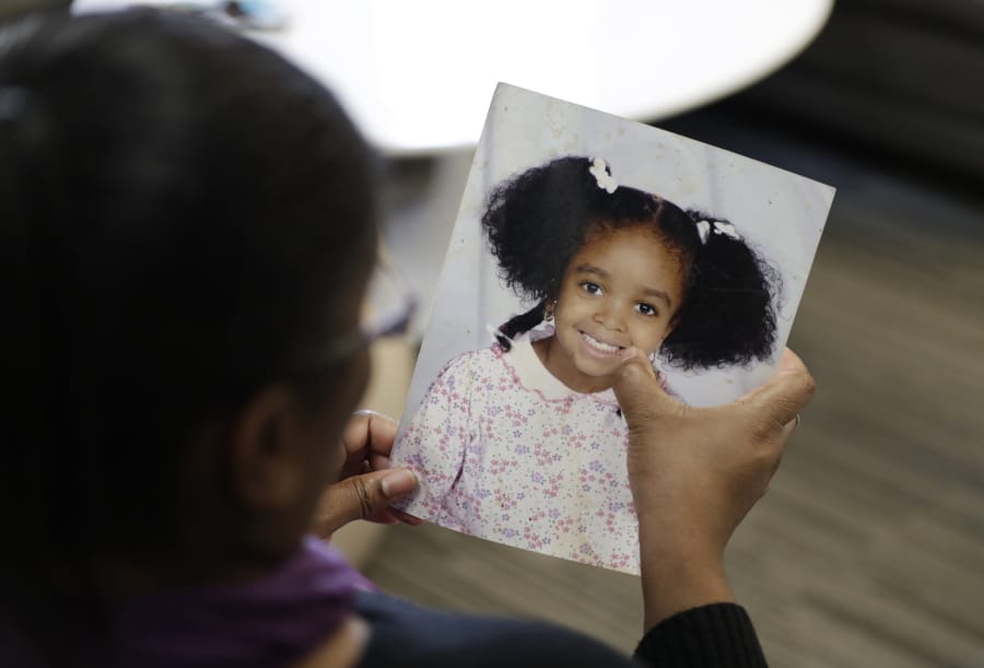 Donnesha Cooper holds a photo of her daughter, Alianna DeFreeze, on Oct. 29 in Cleveland. Alianna was slain in 2017.