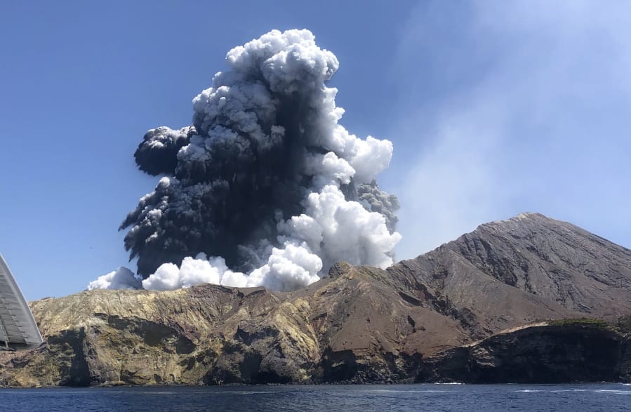 In this Monday, Dec. 9, 2019, photo provided by Lillani Hopkins, shows the eruption of the volcano on White Island off the coast of Whakatane, New Zealand. Lillani Hopkins was feeling seasick and keeping her eyes trained on the open water as her tour boat swung around for a last view of the White Island volcano on Monday afternoon, Dec 9, 2019. Suddenly people started gasping and then her dad whacked her, telling her to turn around. The eruption had been so silent she hadn&#039;t heard it over the noise of the boat&#039;s engines.
