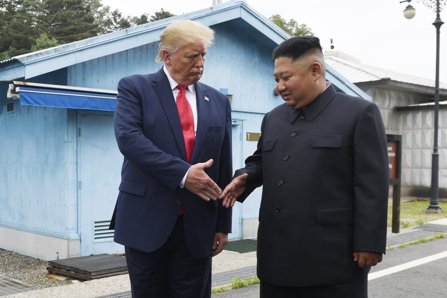 FILE - In this June 30, 2019, file photo, U.S. President Donald Trump meets with North Korean leader Kim Jong Un at the border village of Panmunjom in the Demilitarized Zone, South Korea. North Korea has again insulted President Donald Trump, calling him a &quot;thoughtless and sneaky old man&quot; after he tweeted that North Korean leader Kim Jong Un wouldn&#039;t want to abandon a special relationship between the two leaders and affect the American presidential election by resuming hostile acts.