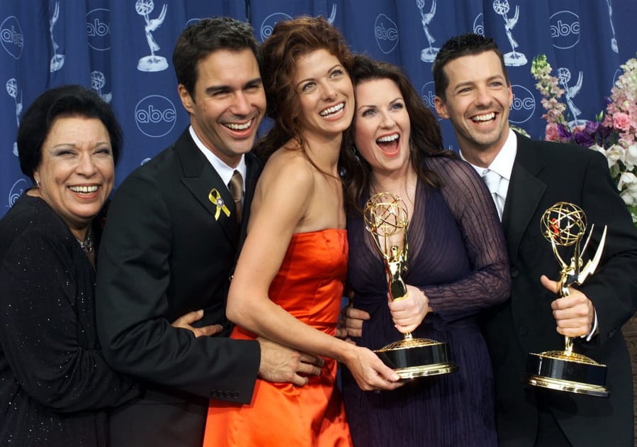 FILE - In this Sept. 10, 2000, file photo, Shelley Morrison, from left, Eric McCormack, Debra Messing, Megan Mullally and Sean Hayes celebrate their awards for their work in &quot;Will &amp; Grace&quot; at the 52nd annual Primetime Emmy Awards in Los Angeles. Morrison, an actress with a 50-year career who was best known for playing a memorable maid on &quot;Will and Grace,&quot; has died. Publicist Lori DeWaal says Morrison died Sunday, Dec. 1, 2019, at Cedars-Sinai Medical Center in Los Angeles from heart failure. She was 83.