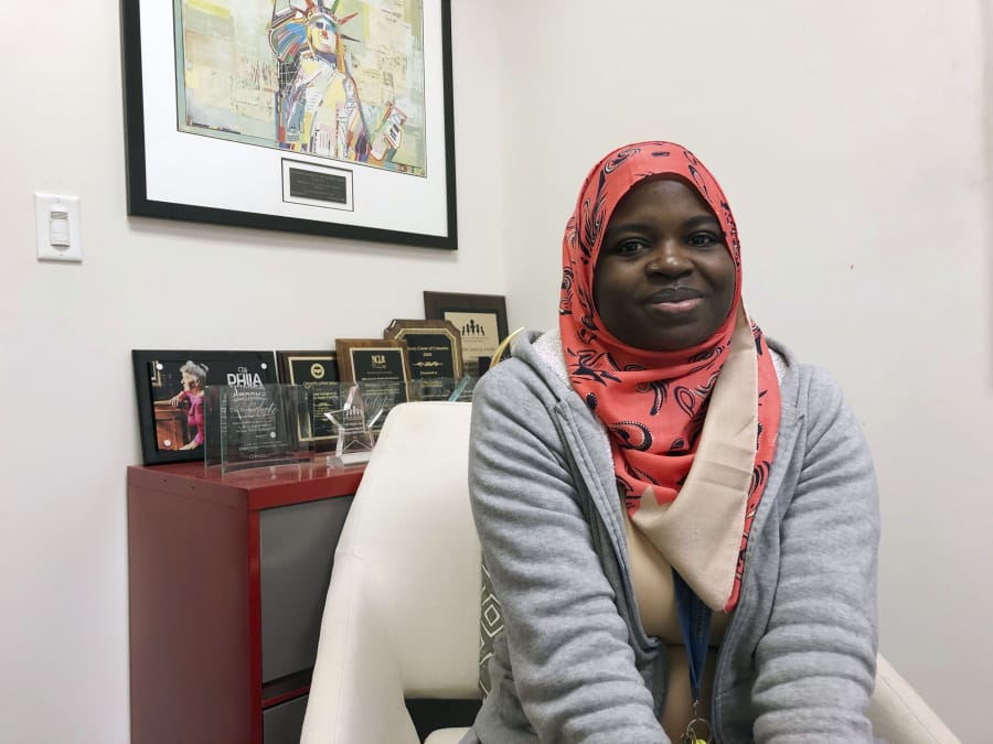 In this Tuesday, Dec. 17, 2019 photo Fartun Abdi, a 25-year-old Somalian sits at work in Nashville, Tenn. Abdi arrived in the U.S. as refugee with her mother and two step-siblings. She now works as a refugee case assistant for Catholic Charities. Abdi said she voted for Lee and prayed over his refugee decision. Tennessee won&#039;t stop resettling refugees, Republican Gov. Bill Lee said Wednesday, Dec. 18, 2019, rejecting the option offered to states by President Donald Trump&#039;s administration.