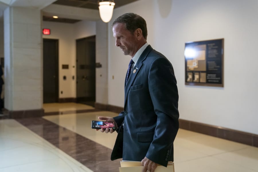 FILE - In this Thursday, Sept. 19, 2019 file photo, Rep. Chris Stewart, R-Utah, a member of the House Intelligence Committee, leaves a meeting with national intelligence inspector general Michael Atkinson about a whistleblower complaint, at the Capitol in Washington. As Democrats champion anti-discrimination protections for the LGBTQ community and Republicans counter with worries about safeguarding religious freedom, Rep. Chris Stewart is offering a proposal on Friday, Dec. 6, 2019 that aims to achieve both goals. (AP Photo/J.
