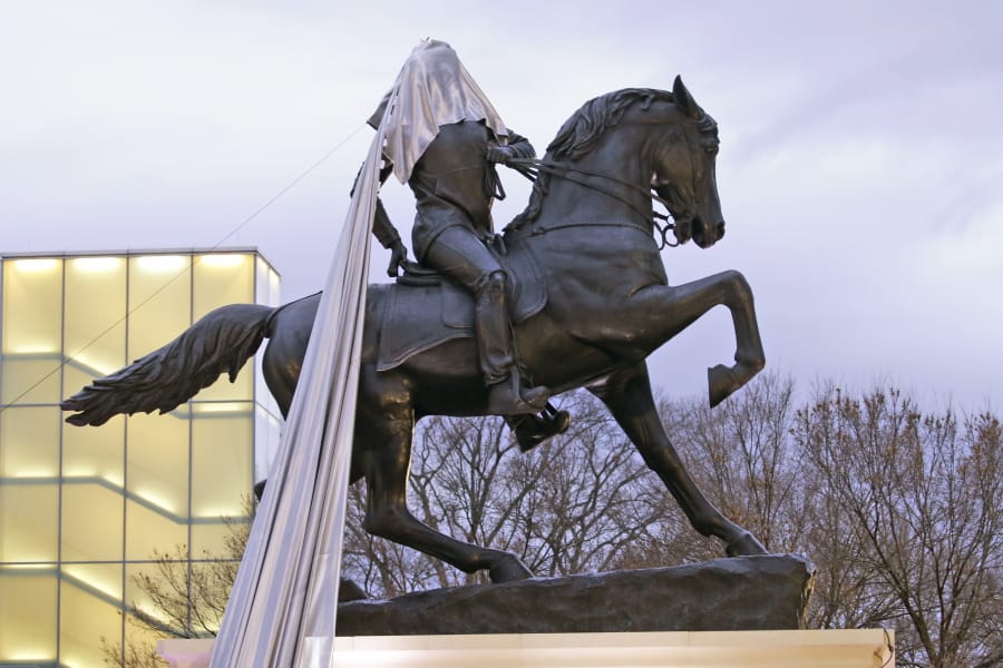 A tarp is stuck during the unveiling ceremony for a statue titled Rumor&#039;s of War by artist Kehinde Wiley at the Virginia Museum of Dine arts in Richmond, Va., Tuesday, Dec. 10, 2019.