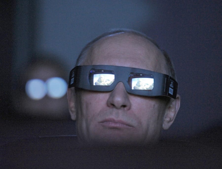 FILE In this file photo taken on Thursday, April 12, 2012, Russian Prime Minister Vladimir Putin wears 3D glasses as he visits Moscow&#039;s Planetarium in Moscow, Russia. Russian President Vladimir Putin prepares to mark his 20th year in power, as the longest-serving leader since Joseph Stalin.