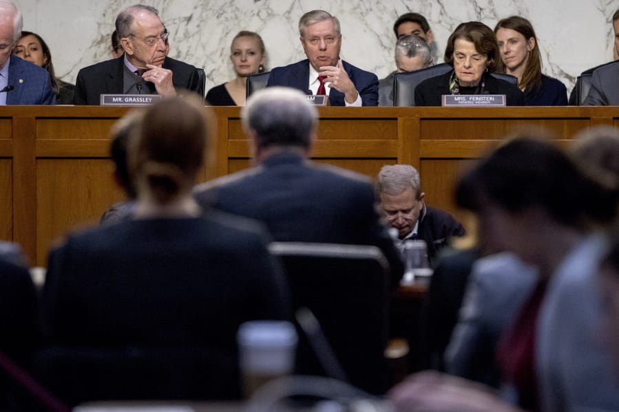 Chairman Lindsey Graham, R-S.C., center, accompanied by Sen. Chuck Grassley, R-Iowa, left, and Ranking Member Sen. Dianne Feinstein, D-Calif., right, speaks as Department of Justice Inspector General Michael Horowitz, center foreground, testifies at a Senate Judiciary Committee hearing on the Inspector General&#039;s report on alleged abuses of the Foreign Intelligence Surveillance Act, Wednesday, Dec. 11, 2019, on Capitol Hill in Washington.