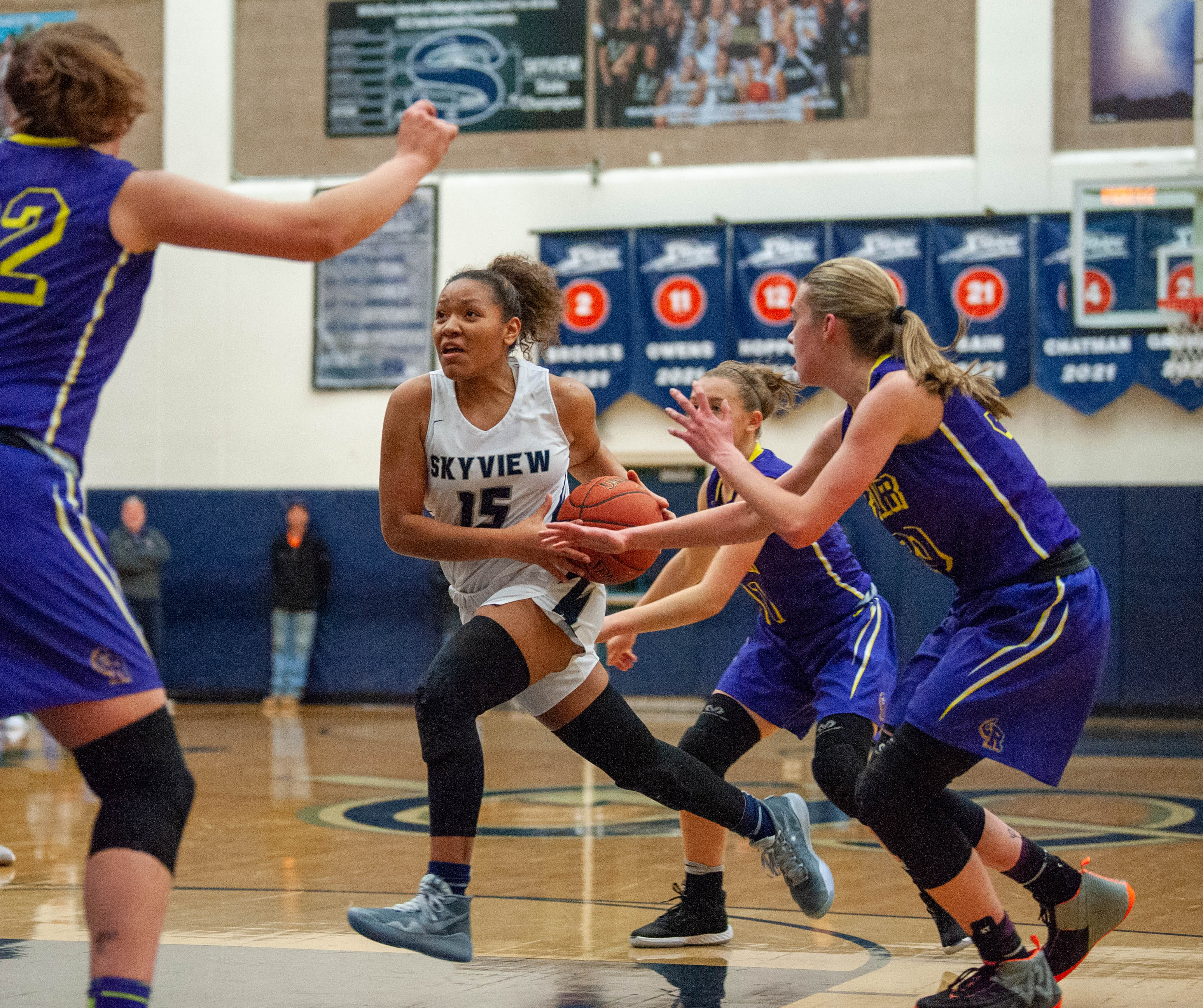 Skyview's Kazz Parks drives through the Columbia River defense.