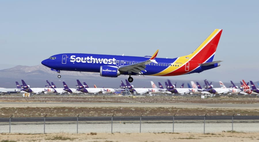FILE - In this March 23, 2019, file photo, a Southwest Airlines Boeing 737 Max aircraft lands at the Southern California Logistics Airport in the high desert town of Victorville, Calif.  The union president of Southwest Airlines pilots worries that Boeing may be rushing the 737 Max back into service, and he says Southwest should consider buying planes from another company.  The union president, Jon Weaks, adds that Boeing has exhibited arrogance and greed that will haunt the company forever.