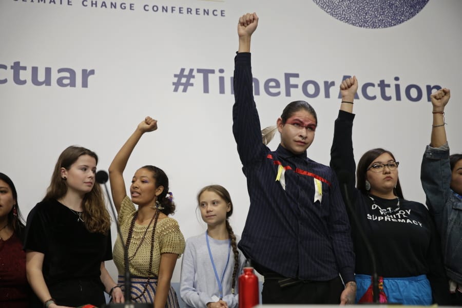 Climate activist Greta Thunberg, center, stands with other young activists Monday at the COP25 Climate summit in Madrid, Spain.