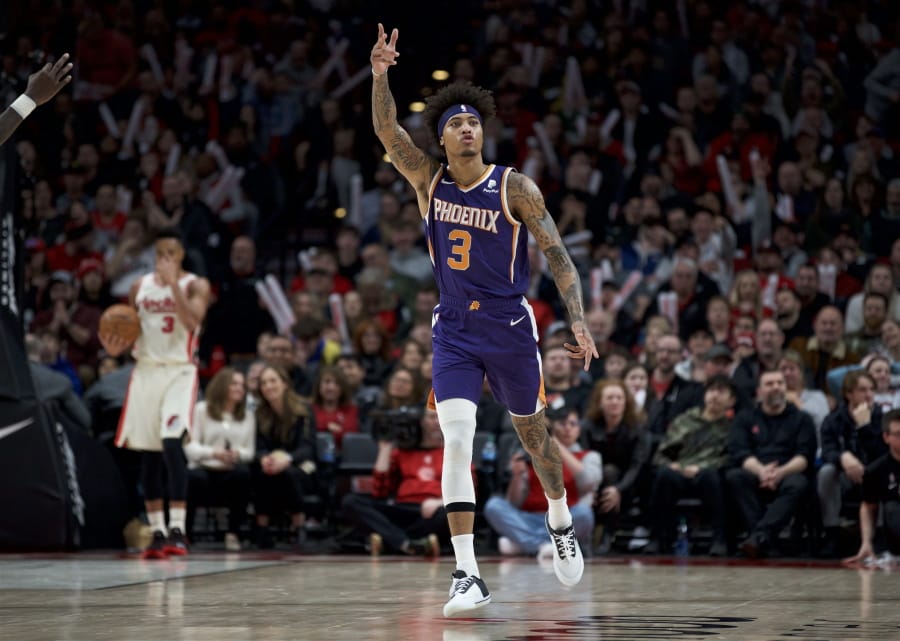 Phoenix Suns forward Kelly Oubre Jr. reacts after making a 3-point basket against the Portland Trail Blazers during the second half of an NBA basketball game in Portland, Ore., Monday, Dec. 30, 2019. The Suns won 122-116.