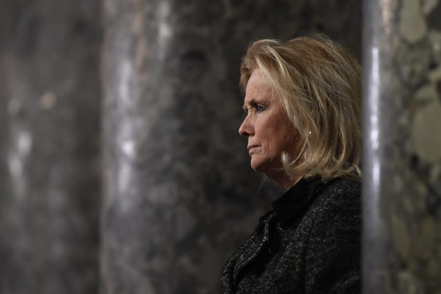 Rep. Debbie Dingell, D-Mich, speaks to reporters on Capitol Hill in Washington, Wednesday, Dec. 18, 2019.
