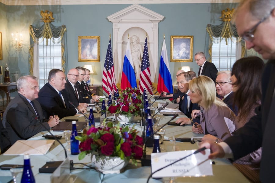 Secretary of State Mike Pompeo, second from left, is seated with Russian Foreign Minister Sergey Lavrov, fifth from right, before their meeting at the State Department, Tues. Dec. 10, 2019 in Washington.